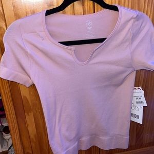 a Large/Medium fitted light pink top from tj maxx and brand is aura